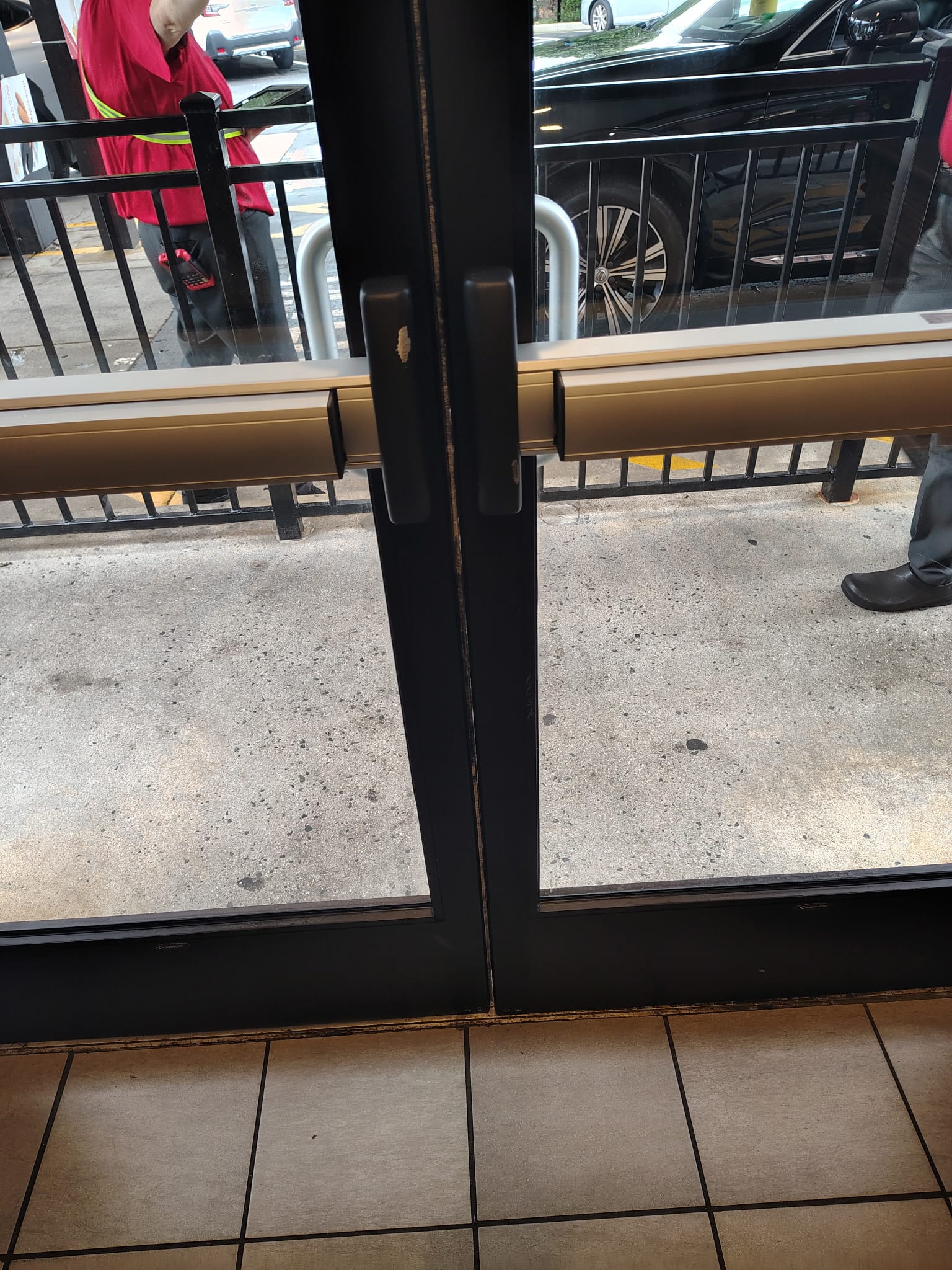 Commercial storefront door with panic bar hardware