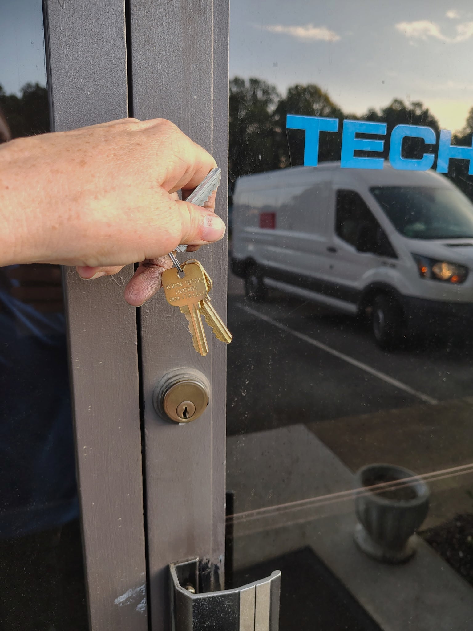 Locksmith keys being used at storefront door